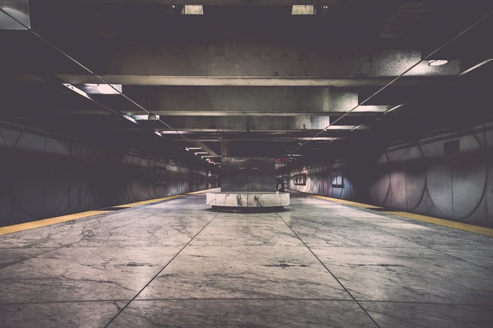 Free Image of Empty modern subway platform with sleek design and marble finish 
