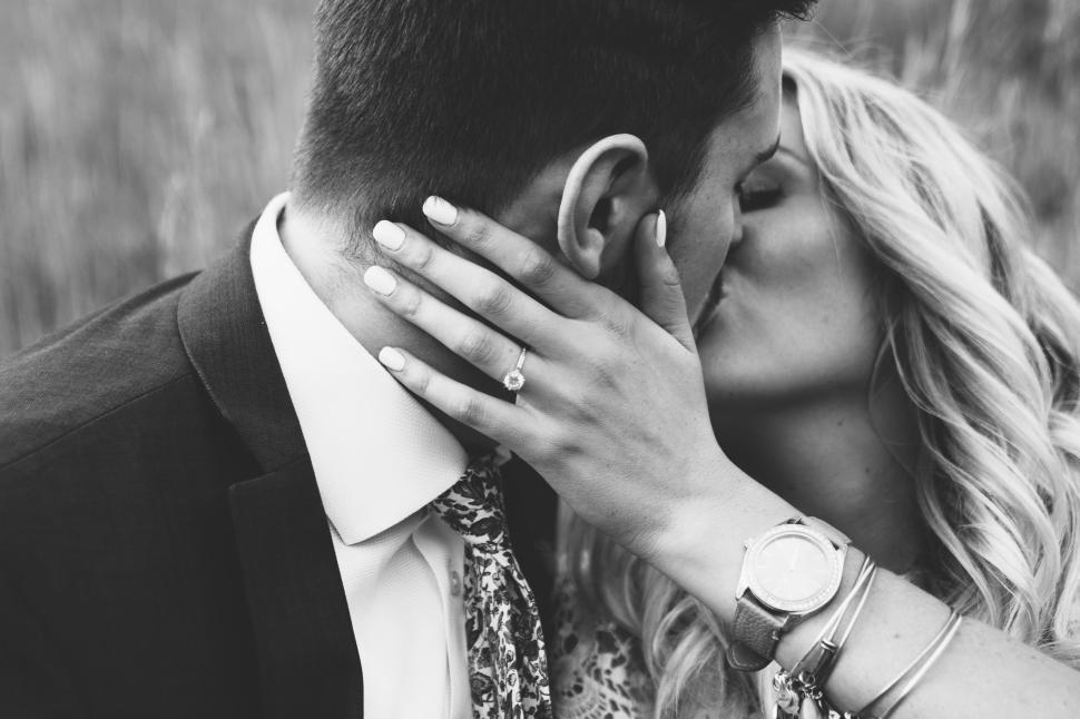 Free Image of Engaged couple sharing a close moment, woman showing engagement ring 