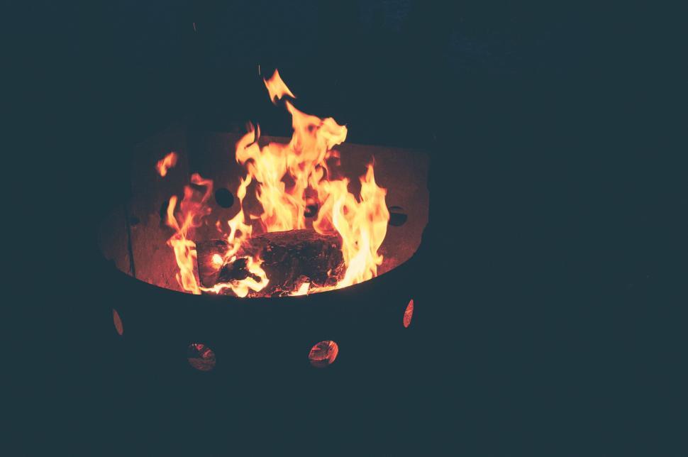Free Image of Cozy and warm campfire glowing with flames in the dark evening 