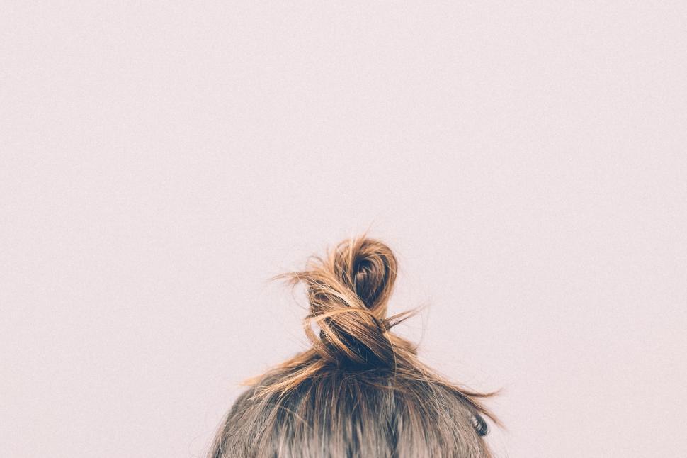 Free Image of Closeup of a messy topknot hair bun, capturing simplicity in detail 