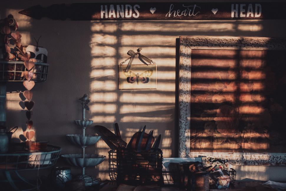 Free Image of Sunlight casting shadows in a cozy room with a rustic feel 