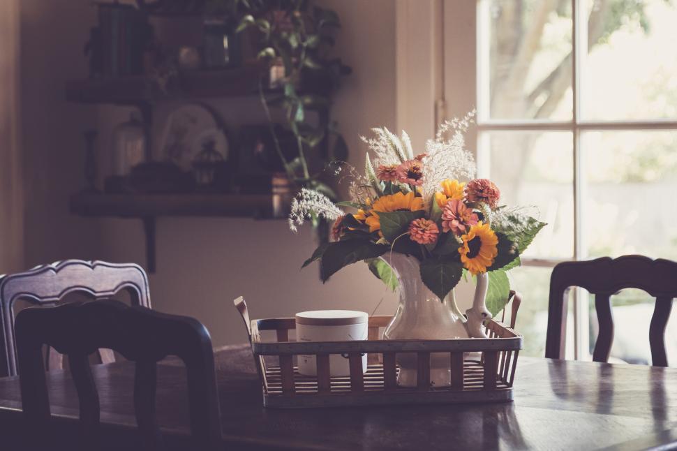 Free Image of Elegant floral arrangement centerpiece on a dining room table 