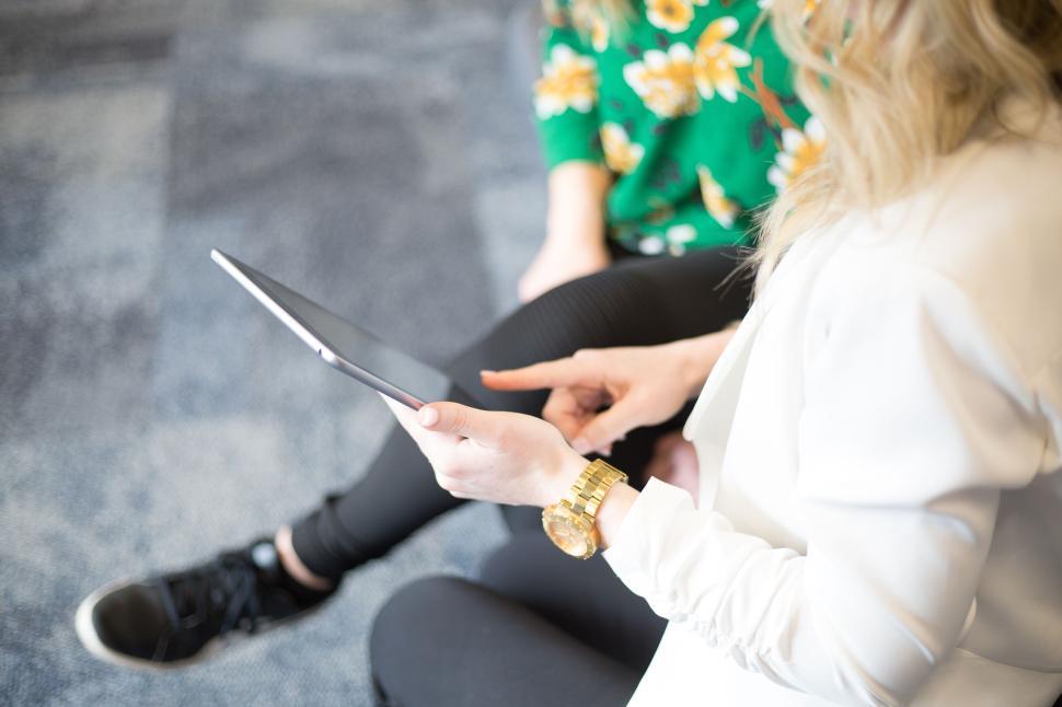 Free Image of Woman using digital tablet for work meeting or collaboration. 