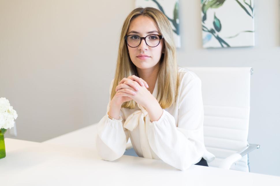 Free Stock Photo of Confident woman in glasses and white blouse at a ...