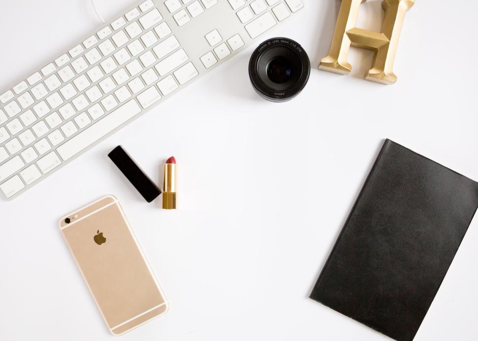 Free Image of Minimalistic office desk arrangement with essential tools and decor 