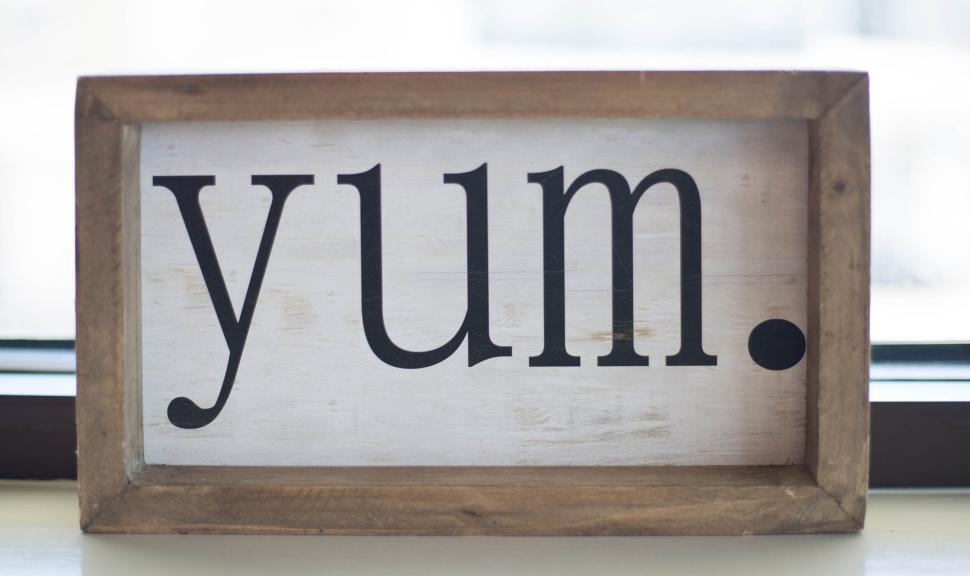 Free Image of Decorative frame with  yum.  text for kitchen or restaurant decor. 
