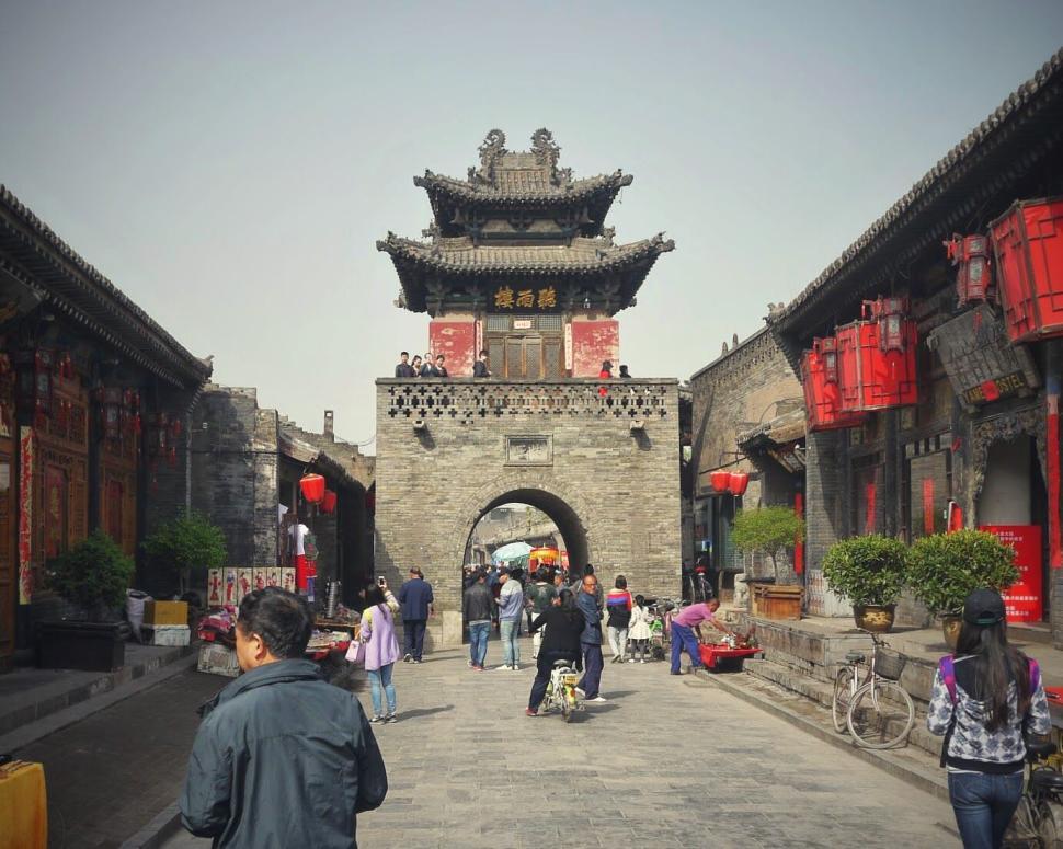 Free Image of Bustling historic street with traditional architecture and people 