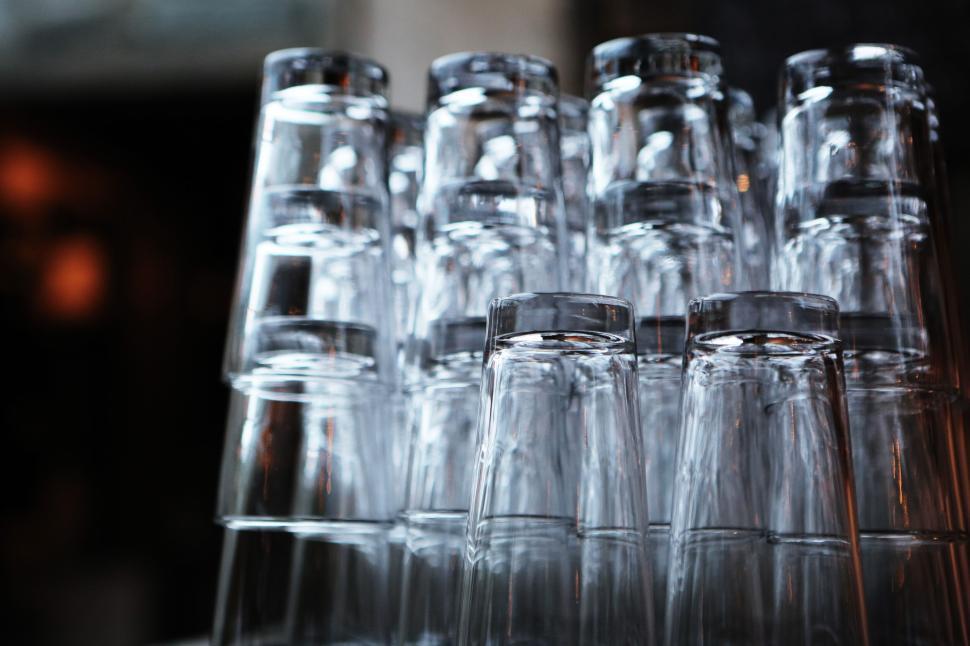 Free Image of Glasses stacked upside down in rows creating repetitive patterns. 