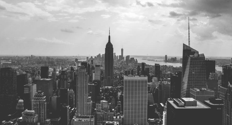 Free Image of Monochromatic cityscape featuring iconic skyscraper at sundown. 