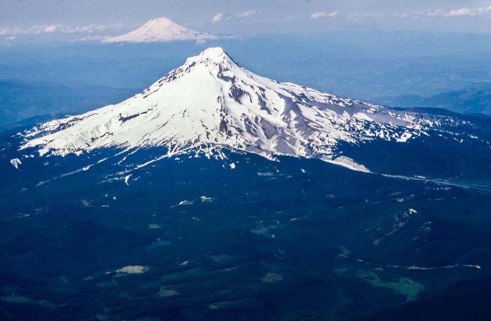 Free Image of Snow-covered majestic mountain peak under a clear blue sky. 