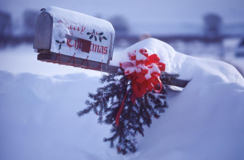 Free Image of Snowy mailbox decorated with  Merry Christmas  greeting sign 