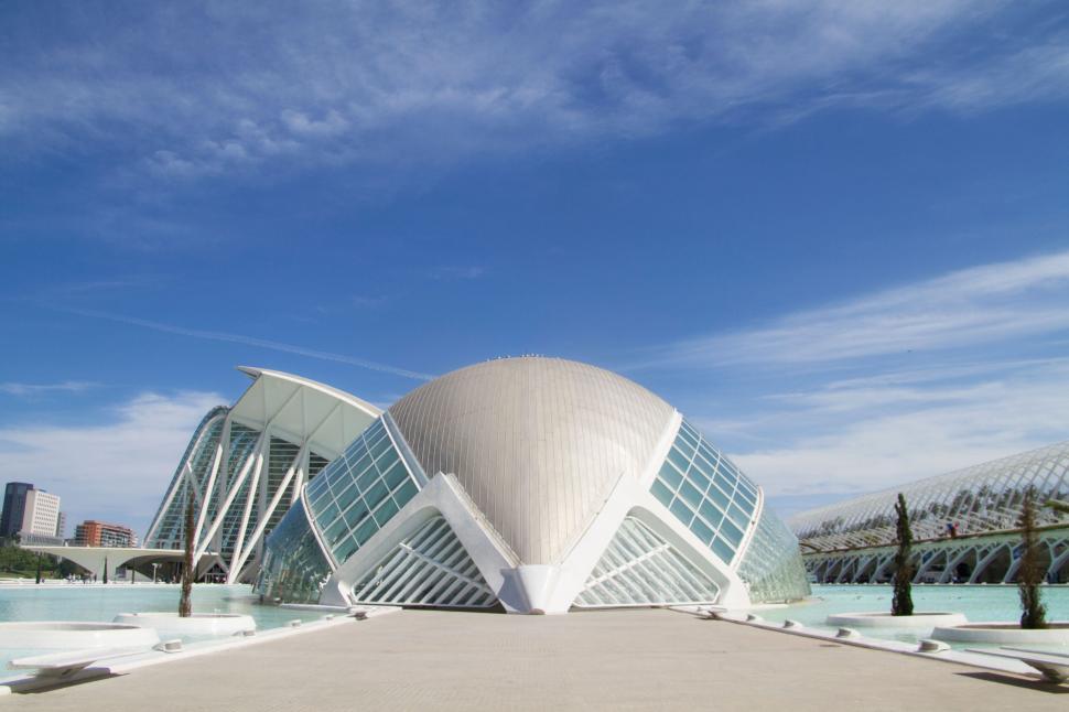 Free Image of Modern architecture with futuristic design under a clear blue sky. 