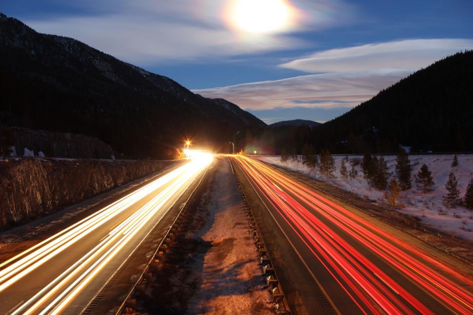 Free Image of Long exposure of highway with trail of car lights at dawn 