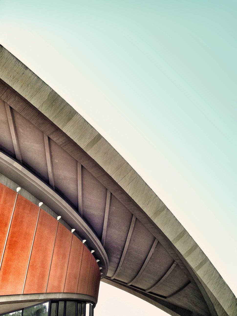 Free Image of Futuristic curved roof structure with architectural detail 
