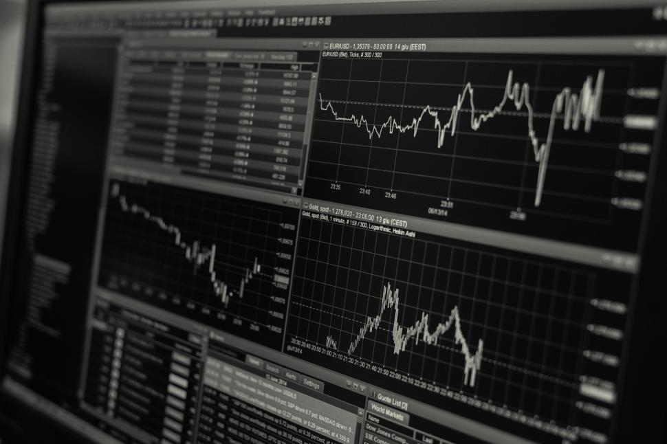 Free Image of Multiple financial graphs on a computer screen displaying data trends. 