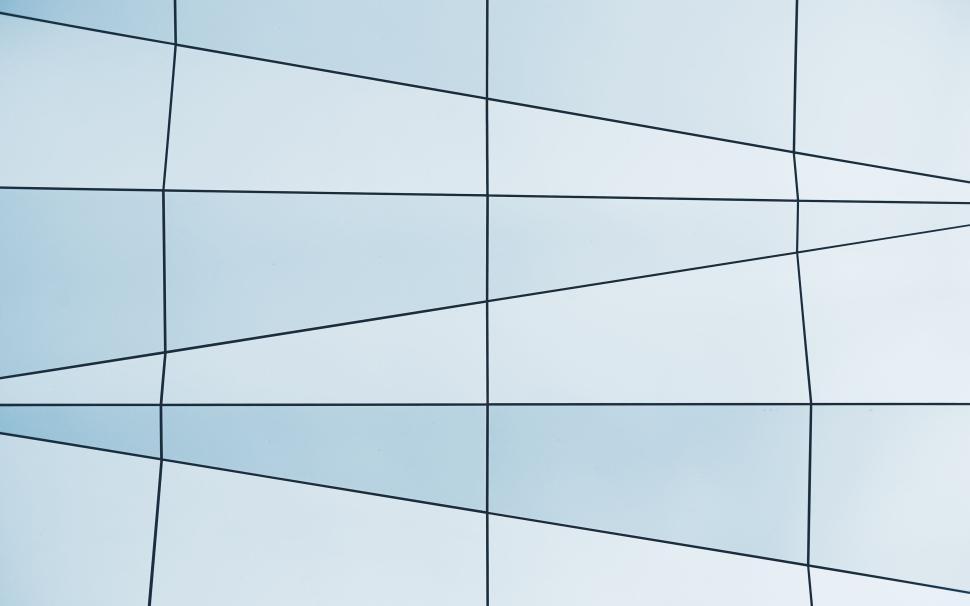 Free Image of Minimalist glass building architecture intersecting lines and shapes 