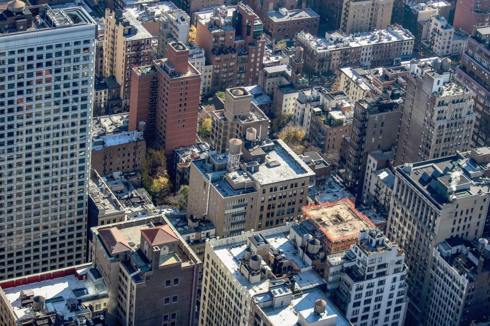 Free Image of Aerial view of a densely packed urban area with various buildings 