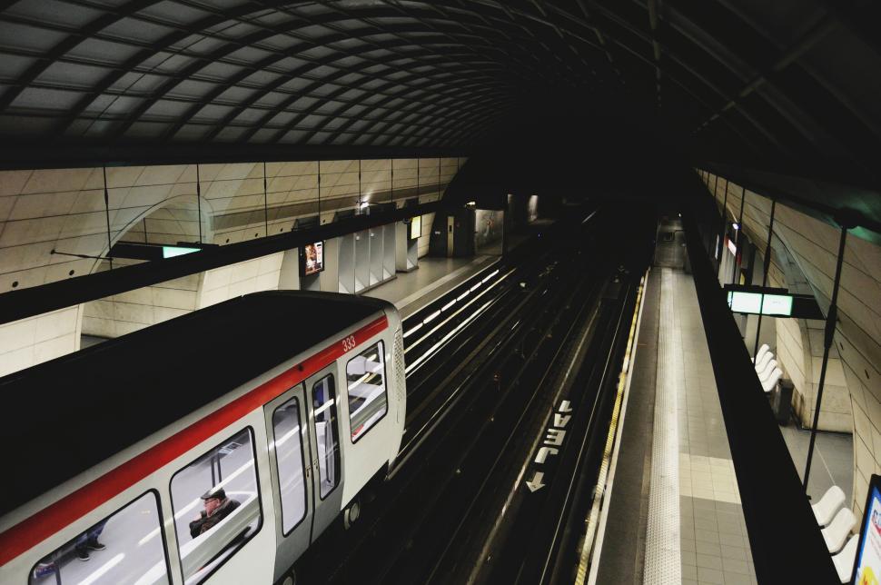 Free Image of Modern train station with red and white metro train at platform 