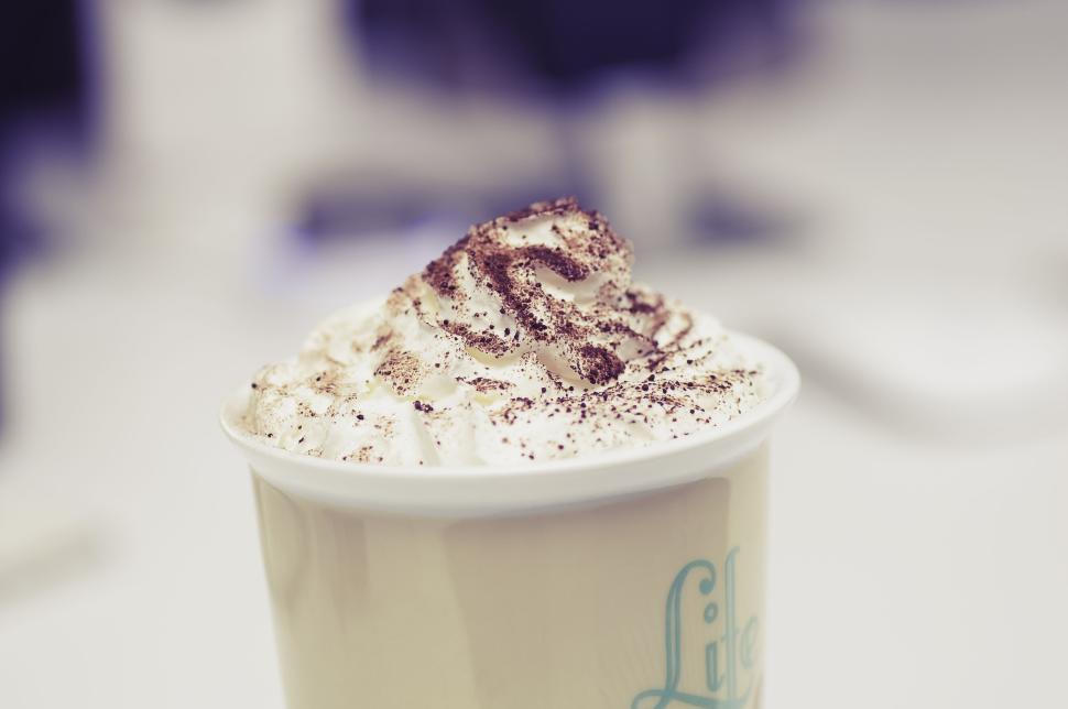Free Image of Cappuccino with whipped cream sprinkled with chocolate powder 