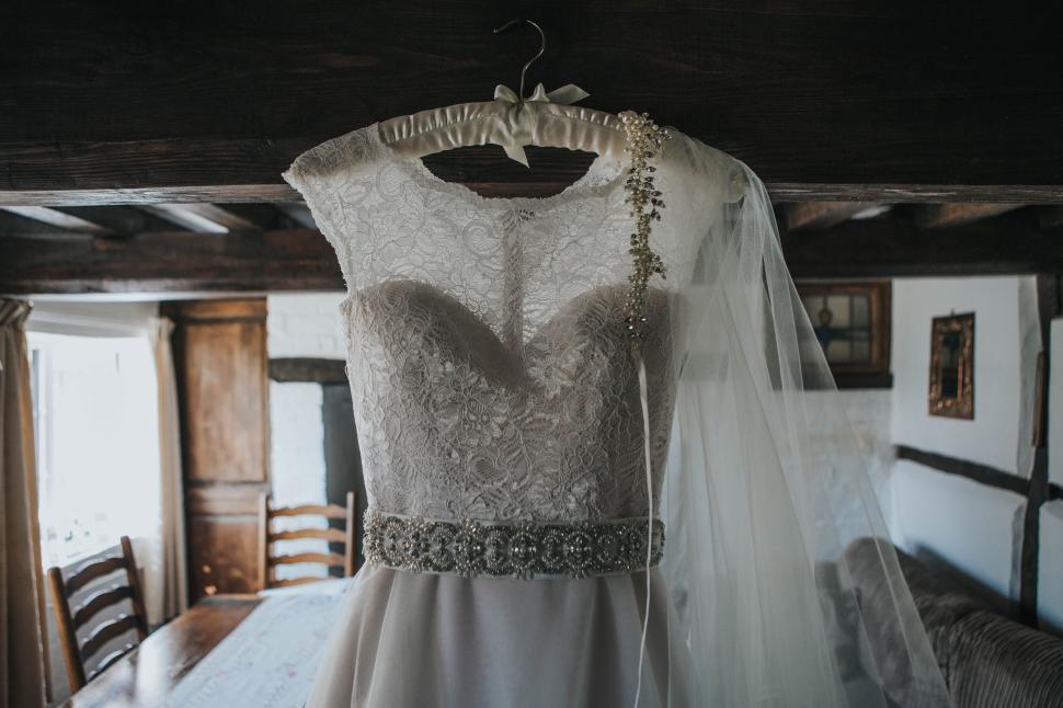 Free Stock Photo of White lace bridal gown hanging in rustic, wooden-beamed room. | Download Free Images and Free Illustrations Free Stock Photo of White lace bridal gown hanging in rustic, wooden-beamed room. | Download Free Images and Free Illustrations