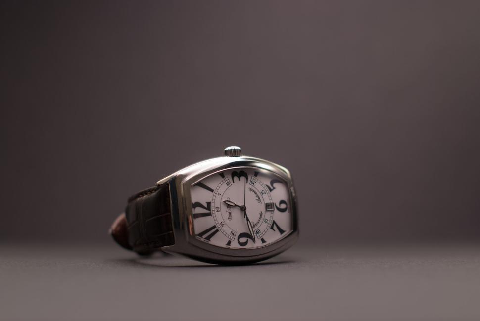 elegant-wristwatch-with-leather-strap-placed-against-a-dark-backdrop..jpg