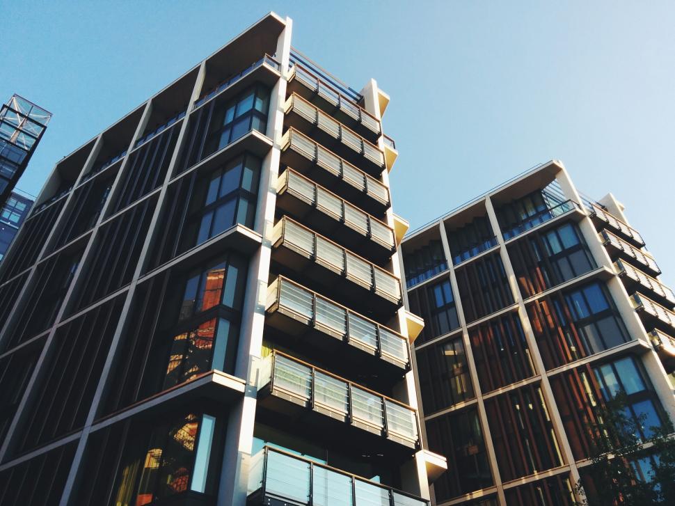 Free Image of Modern apartment buildings with large balconies against the sky. 