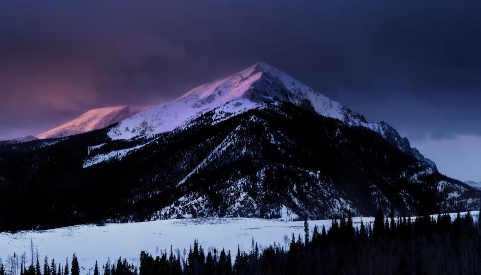 Free Image of Majestic mountain peak under dark twilight sky 