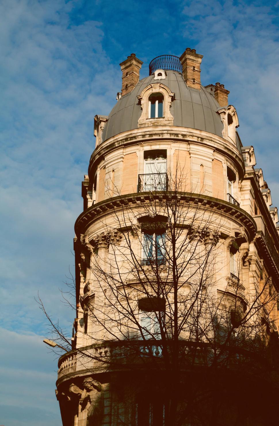 Free Image of Historic building with ornate architecture against partly cloudy sky. 
