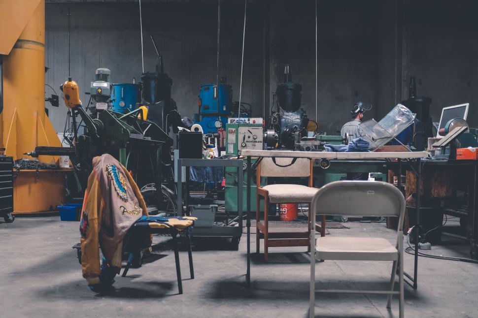Free Image of Industrial workspace with machines and equipment pieces 