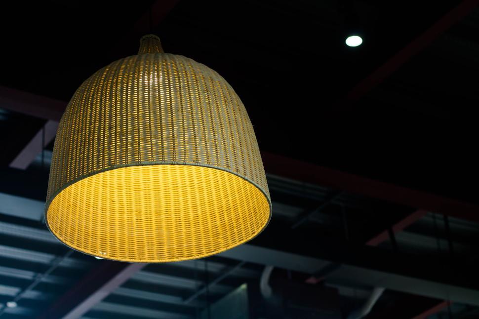 Free Image of Wicker pendant lamp hanging from ceiling in caf? 