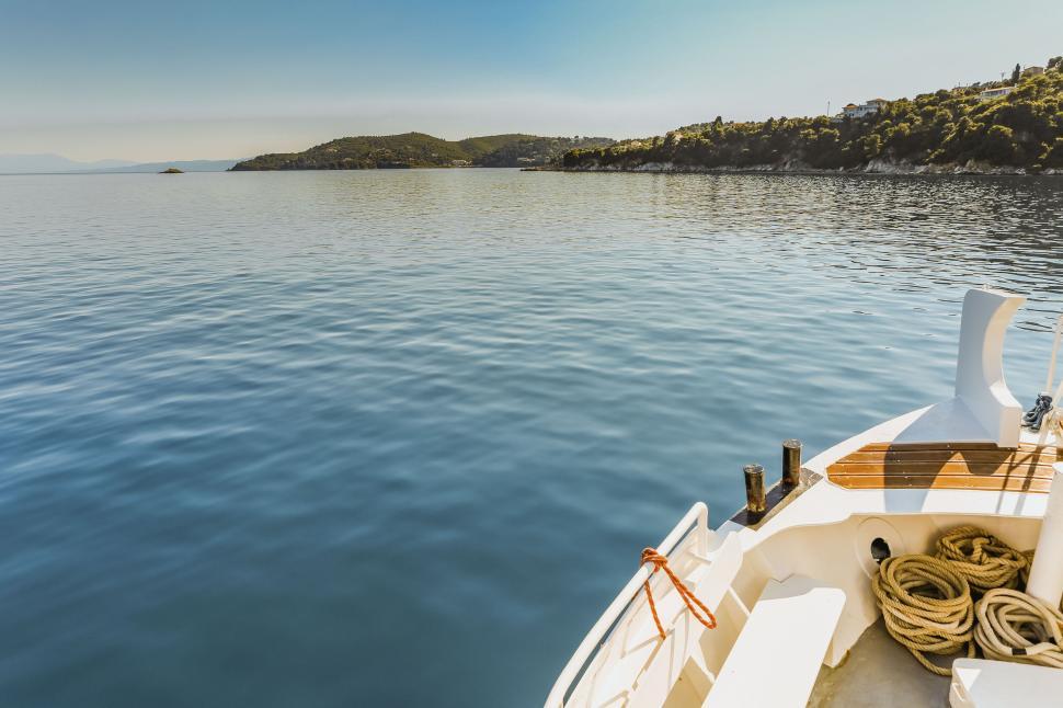 Free Image of Boat Sailing Through Clear Blue Mediterranean Waters 
