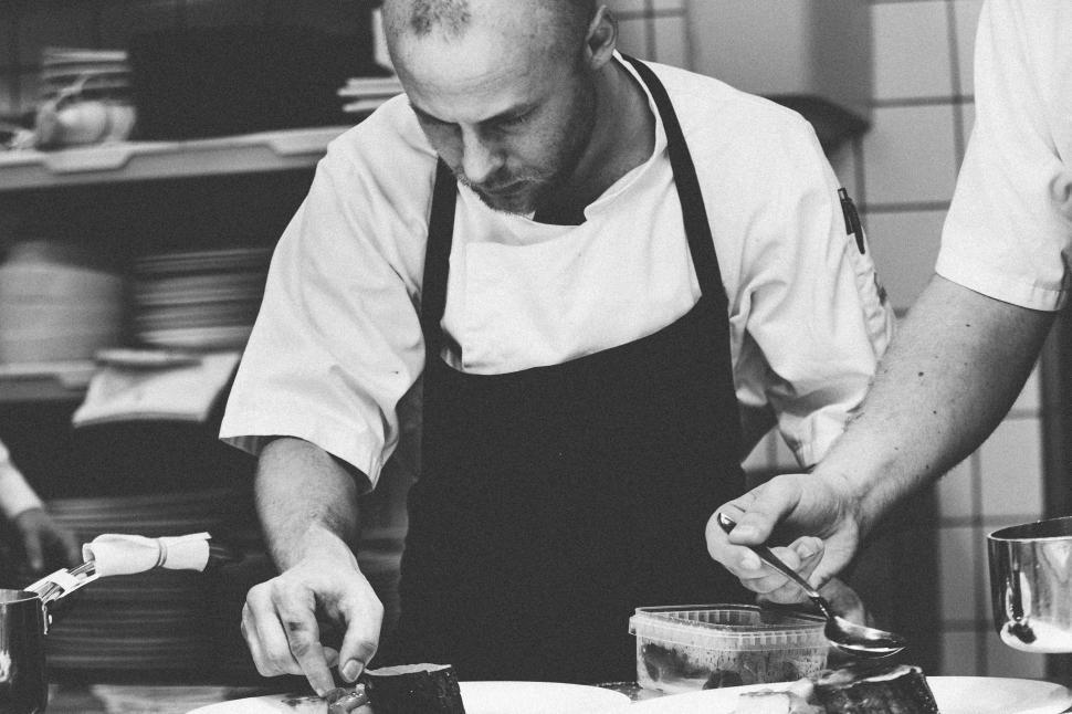 Free Image of Chefs Working Intently in a Professional Restaurant Kitchen 