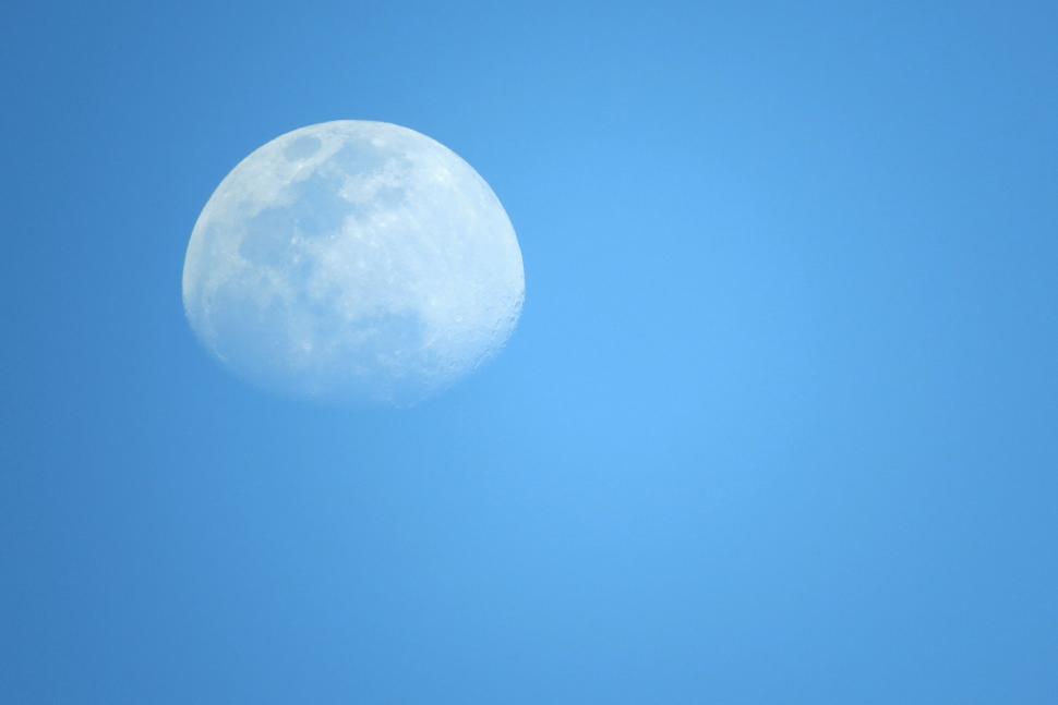 Free Image of Moon visible in the daytime sky, floating gracefully. 