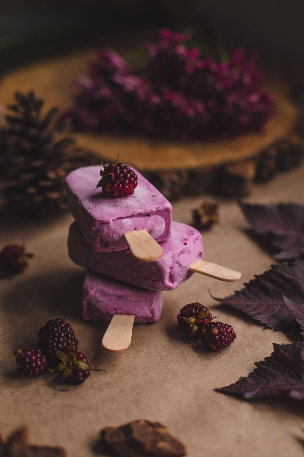 Free Image of Two berry popsicles stacked with fresh berries 