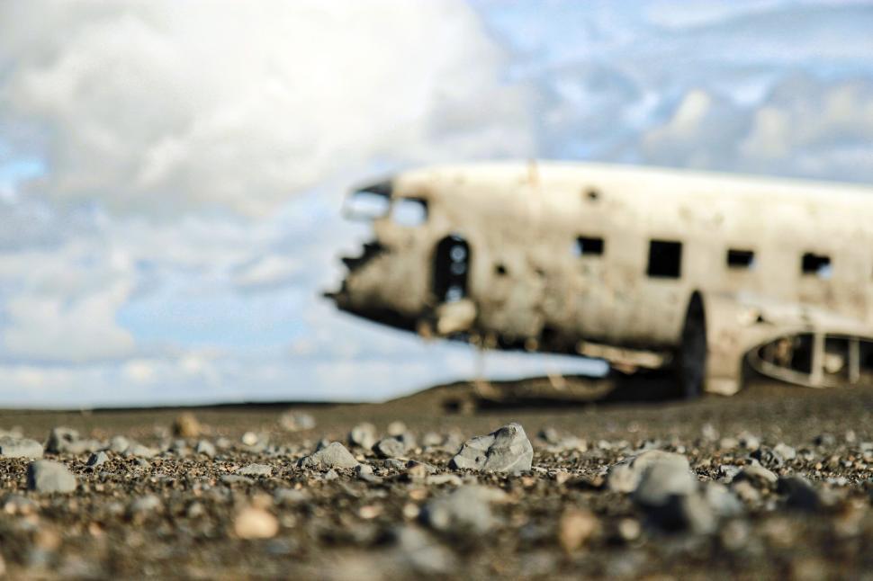 Free Image of Abandoned, weathered airplane wreck in a desolate landscape 