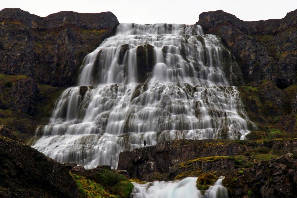 Free Image of Majestic waterfall cascades over rocky ledges. 