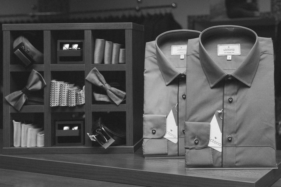 Free Image of Men’s shirts with accessories in store display 