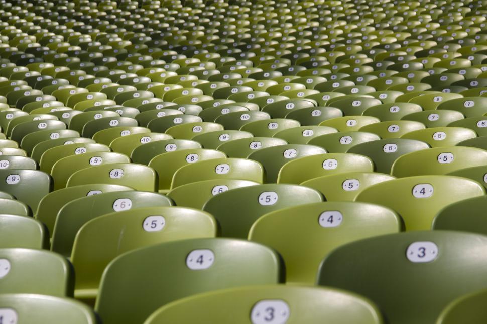 Free Image of Rows of green stadium seats all neatly arranged in place 