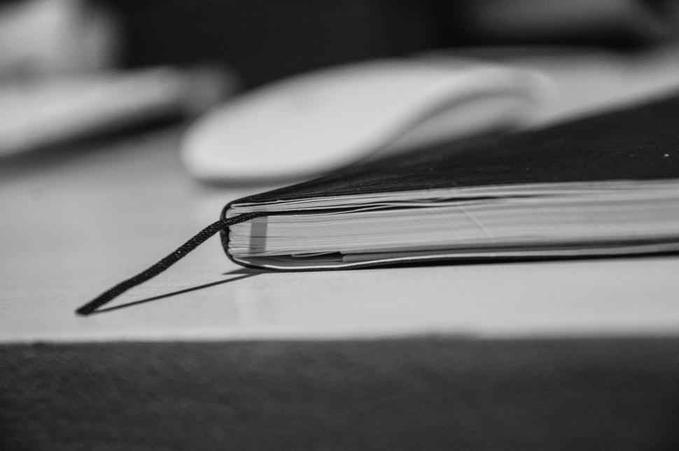 Free Image of Closed black notebook with black bookmark on the table 