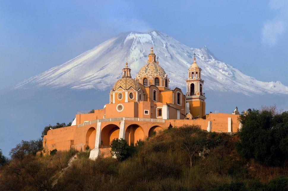 Free Image of Chapel with volcanic mountain backdrop in rural setting 