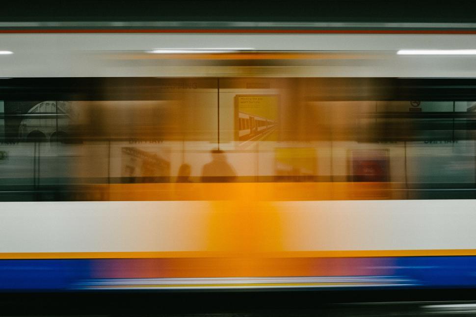 Free Image of Blurred train in motion at an underground station. 