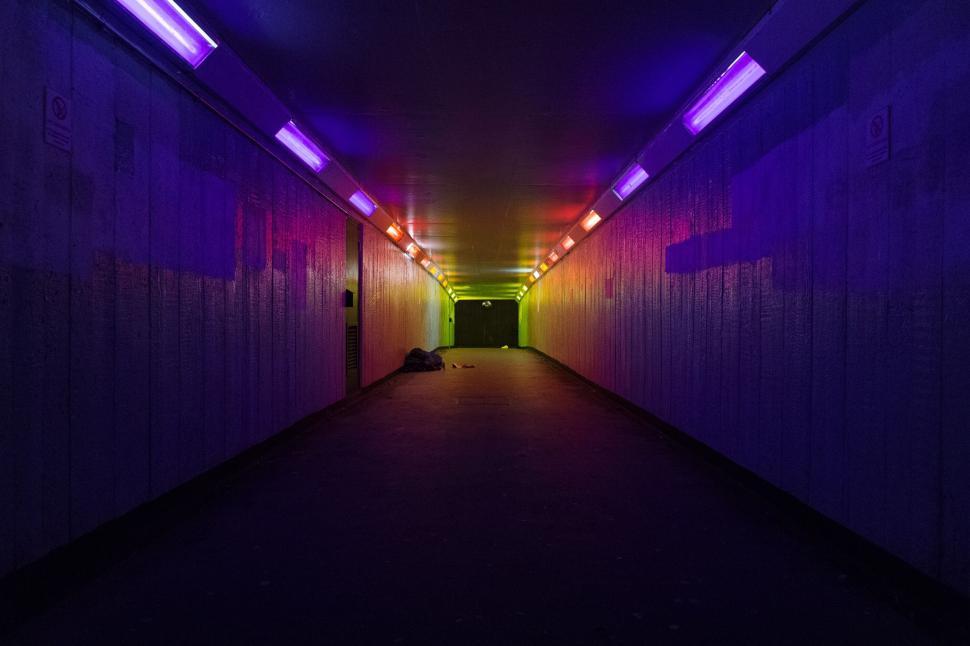 Free Image of Colorful illuminated tunnel with vibrant neon lighting 