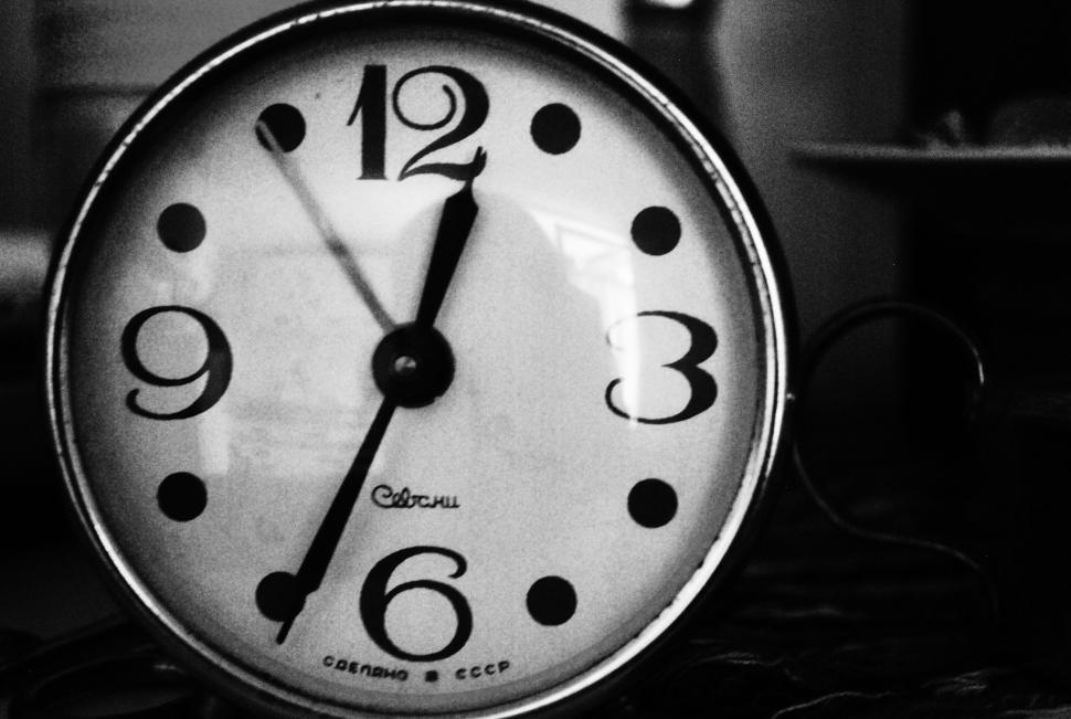 Vintage clock with Soviet Union markings, black and white.