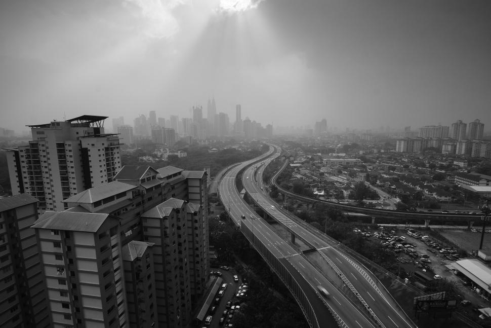 Free Image of Black and white aerial view of a highway in the city. 