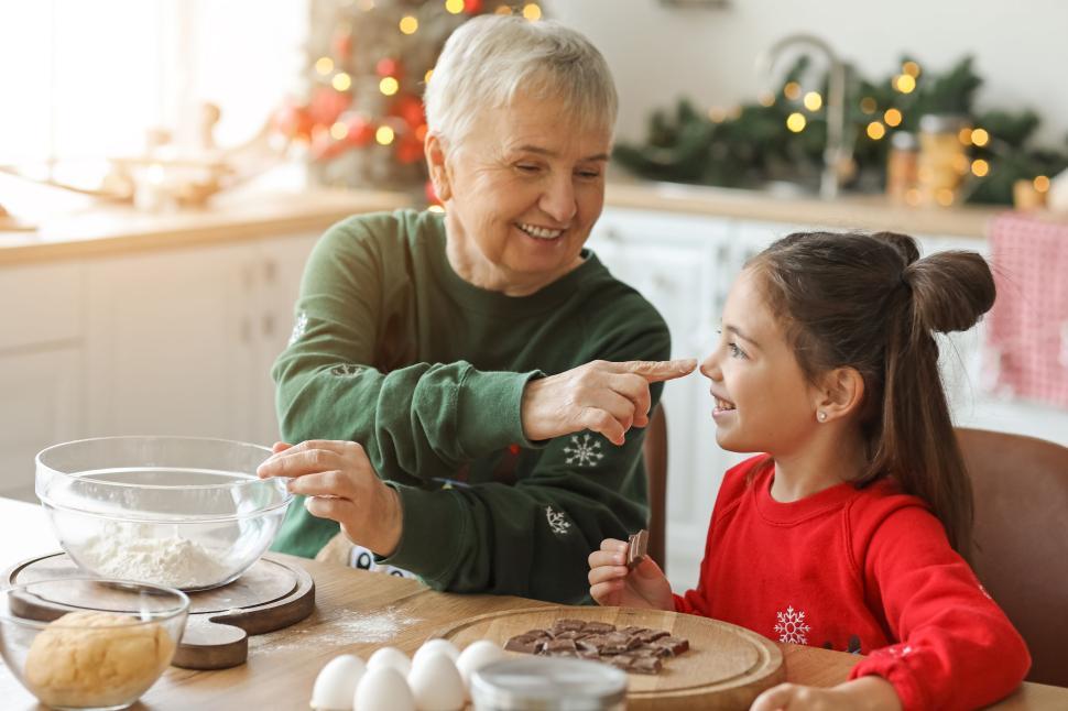 Free Image of Grandmother and granddaughter sharing baking moments 