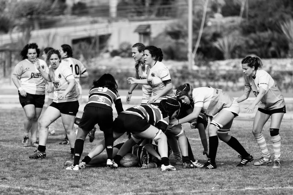 Free Image of Women s rugby team in dynamic action during game play 