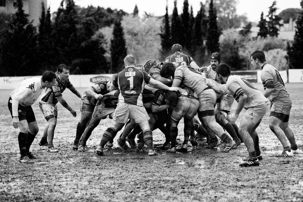 Free Image of Men s rugby team in muddy match in intense competition 