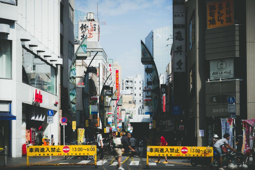 Free Image of Busy urban street in daytime with people and buildings 