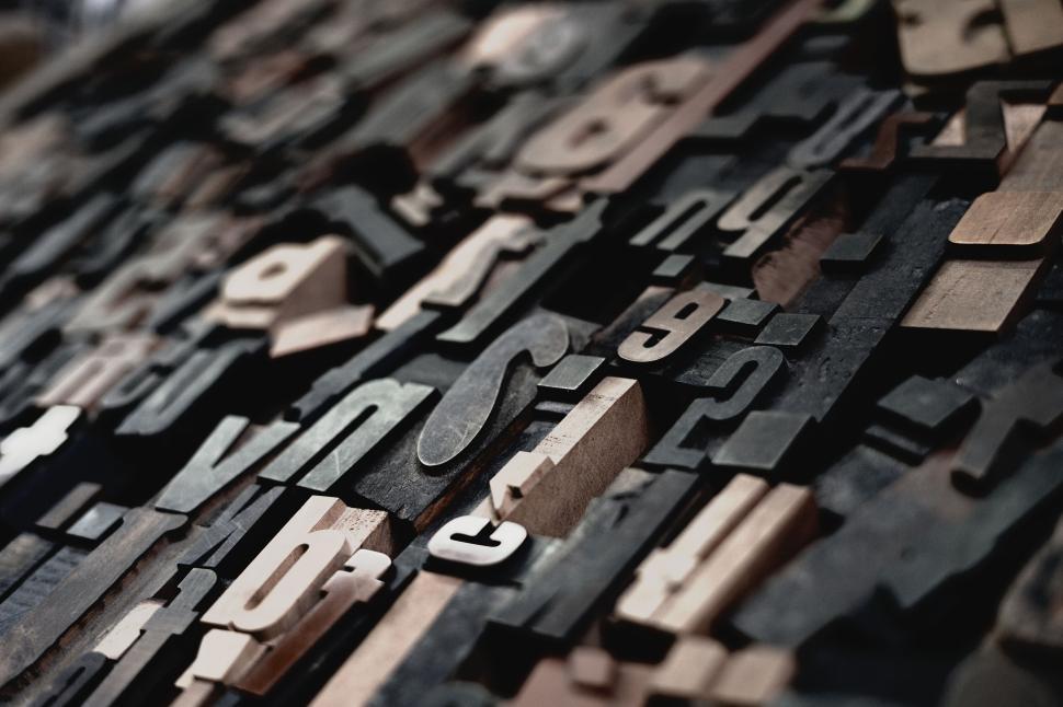 Free Image of Abstract close-up of varied wooden letterpress blocks 