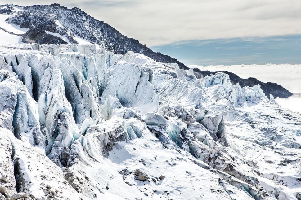 Free Image of Expansive glacier with rugged ice formations outdoor. 